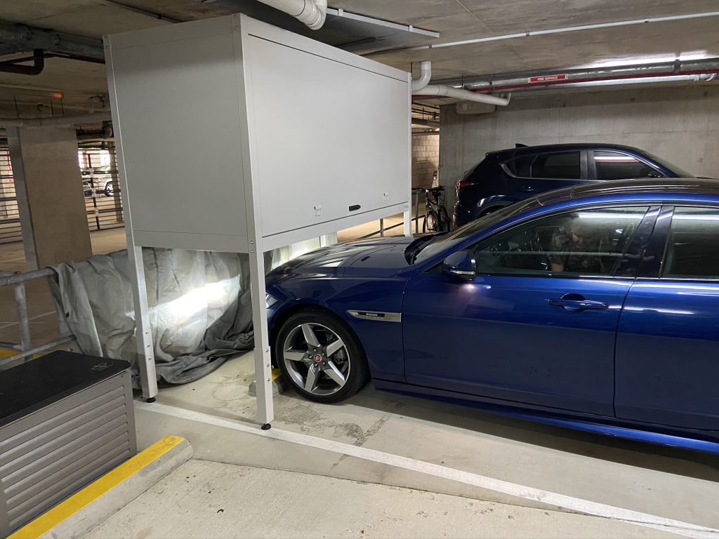 car driving under large over bonnet storage 