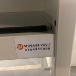 storage vault logo on over bonnet shelf